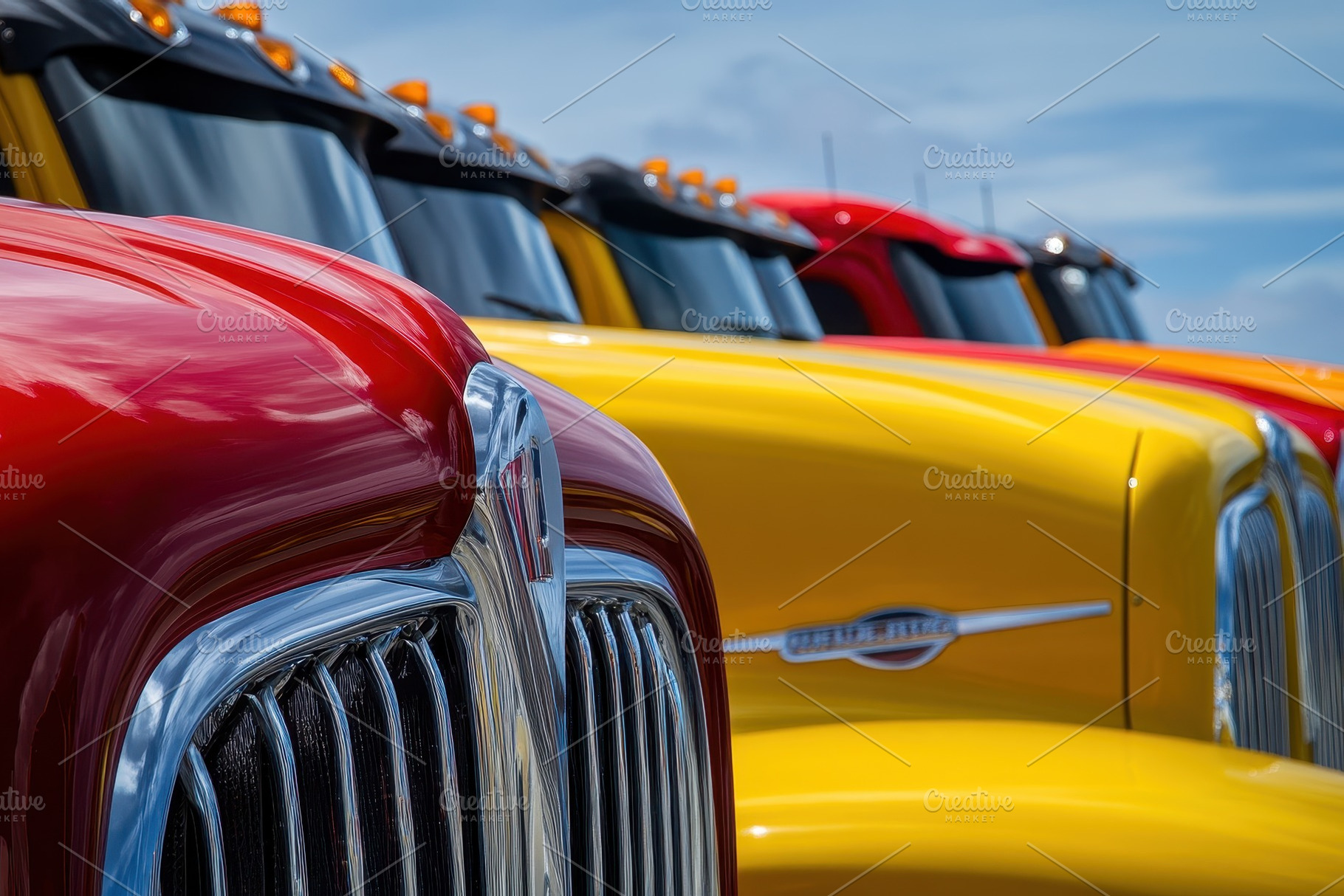 Colorful semitrucks parked in a row, a Photo by Pavel_design