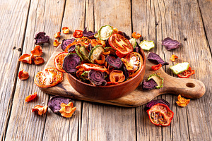 Healthy alternative for traditional potato chips, dry vegetables, a Food & Drink Photo by Rimma