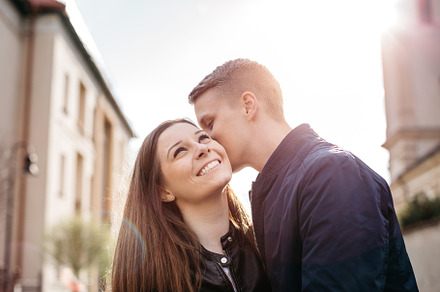Boyfriend whispering to girlfriend., a Person Photo by Newman Studio