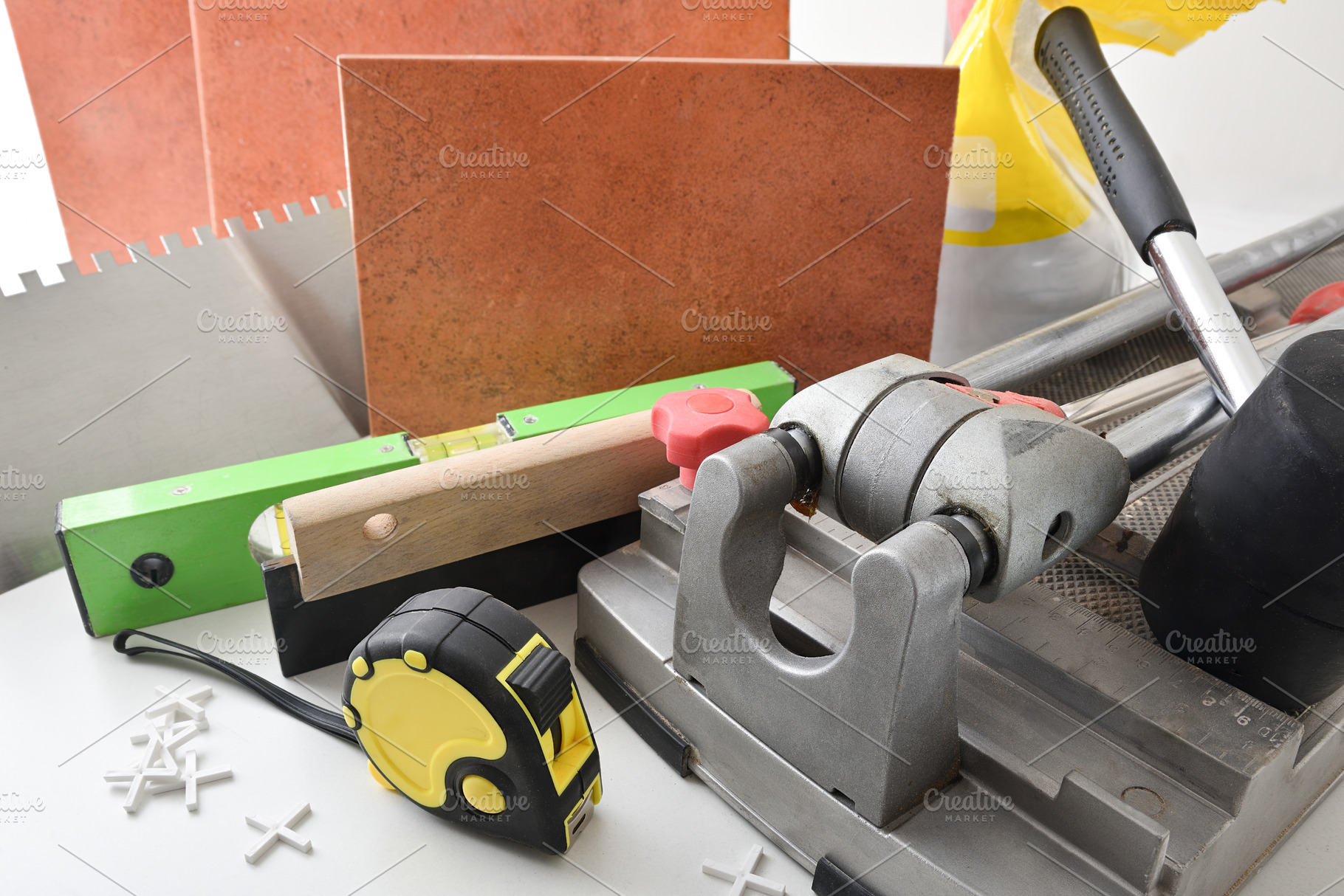 Supply of tools and tiling material on table elevated view, an Architecture Photo by Davizro's Market