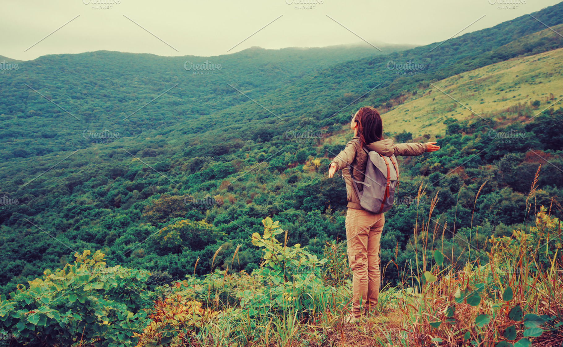 Happy traveler woman standing, a Person Photo by P&G