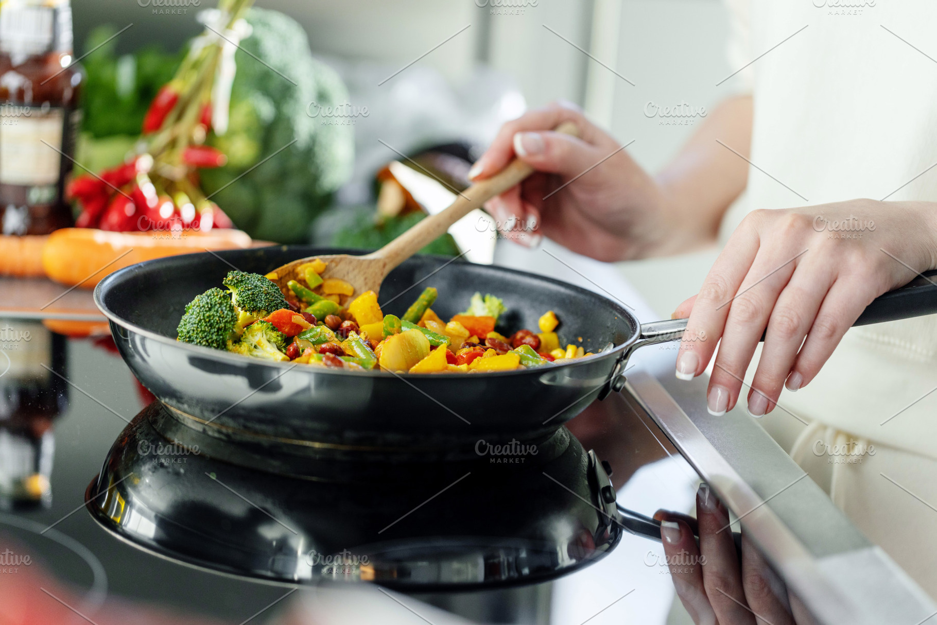 Woman cooking vegetables on pan, a Food & Drink Photo by Valeria Art