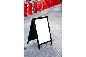 Blank A-frame sidewalk sign on, a Business Photo by volodymyrshtun13795