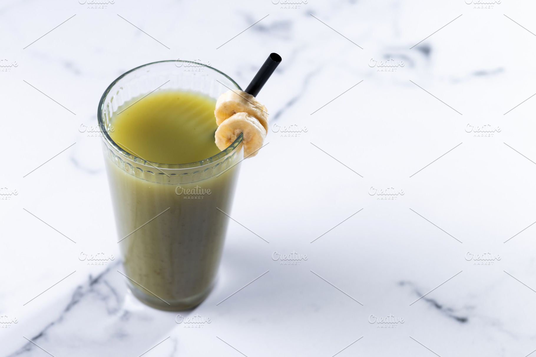 Green smoothie with spinach,banana, apple, and lemon isolated on, a Food & Drink Photo by etorres69