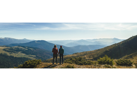 Couple of Hikers With Backpacks in