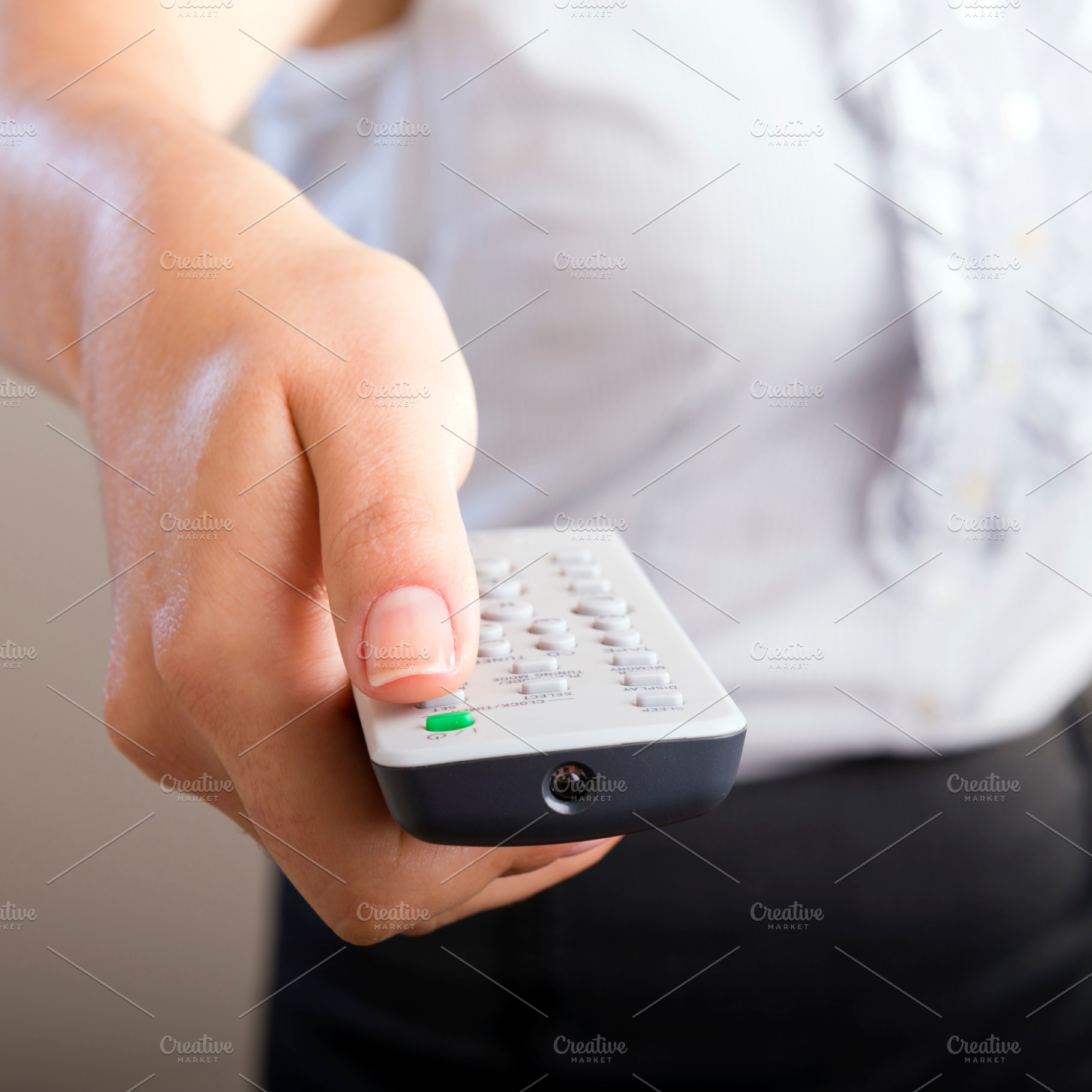 Woman Holding Remote Control, a Background Photo by THP Creative