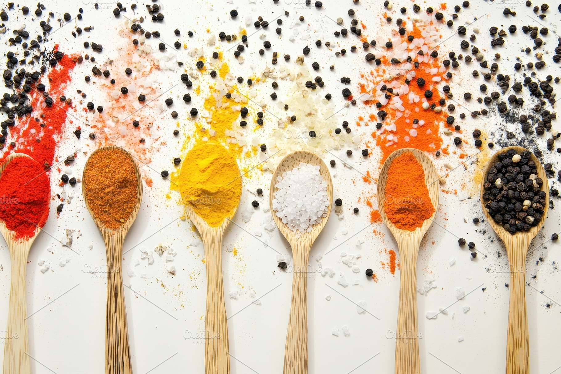 Variety of spices in wooden spoons, a Photo by Pavel_design