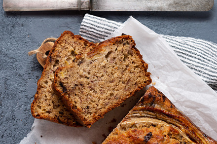 Homemade banana bread  with chocolate chips on a gray concrete b