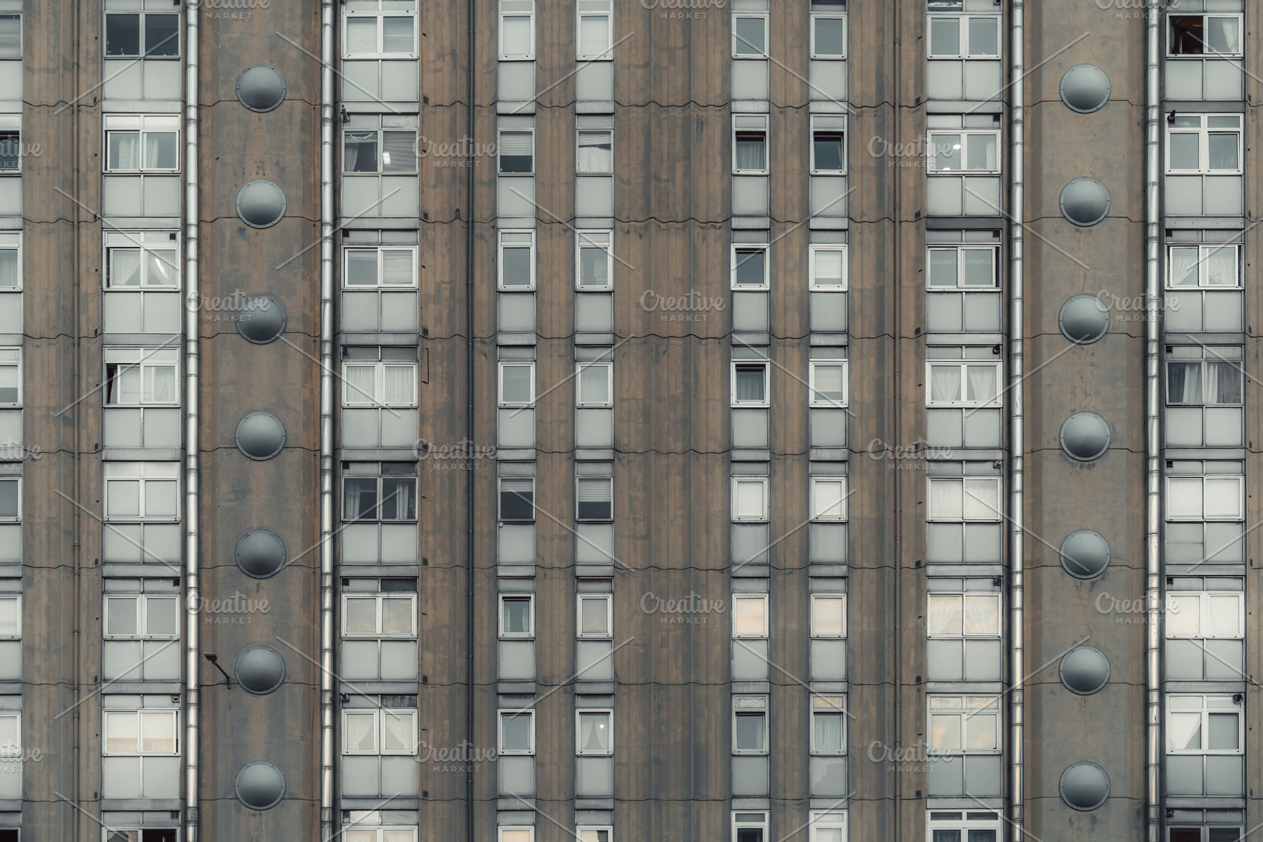 Brutalist apartment facade symmetry, an Architecture Photo by SkyNext