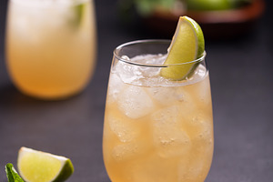 Fresh cocktail prepared with ginger beer, lime, mint and ice, a Food & Drink Photo by zakiroff