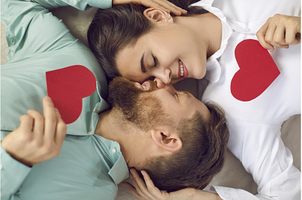 Happy romantic couple lying face to, a Person Photo by StudioRomantic