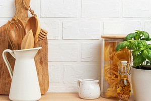 Kitchen utensils, pasta and basil showing rustic cooking and hea, a Food & Drink Photo by Olena Rudo