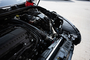 Detailed view under the hood of a car showing its engine components, a Transportation Photo by AS photostudio