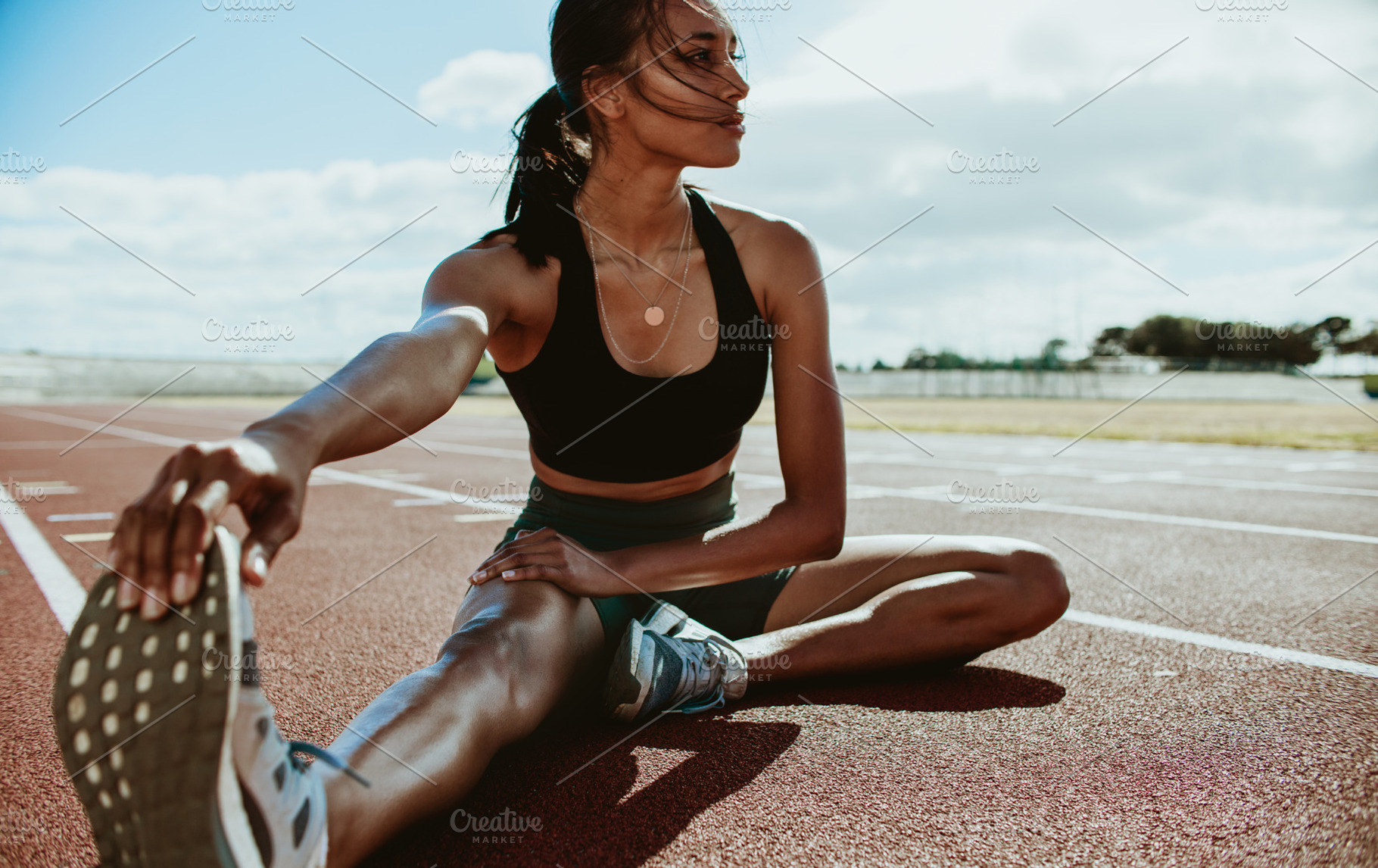 Athlete doing stretching exercises, a Person Photo by Jacob Lund