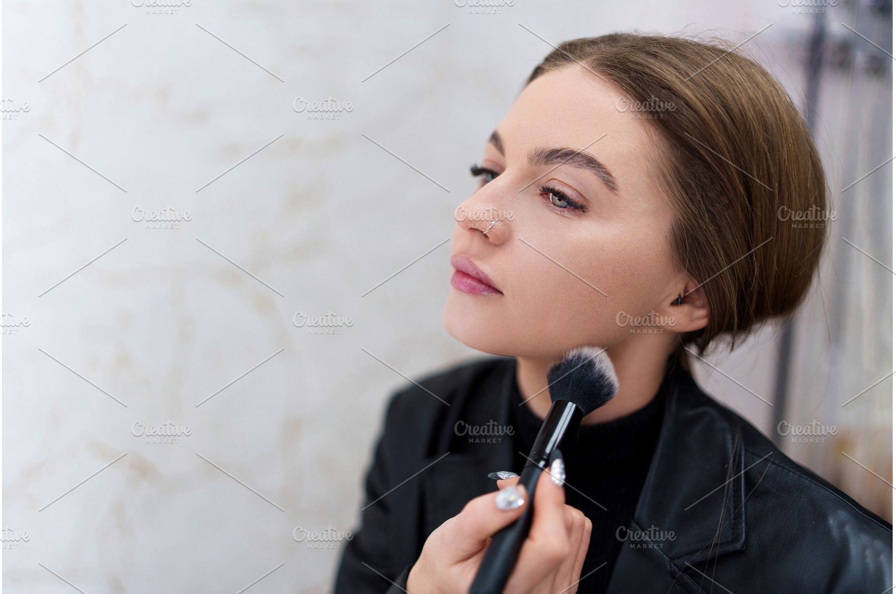 Close up portrait of a woman making, a Beauty & Fashion Photo by Iván Moreno STOCK PHOTO