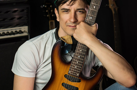 Electric guitar player, a Person Photo by Elena Vagengeim