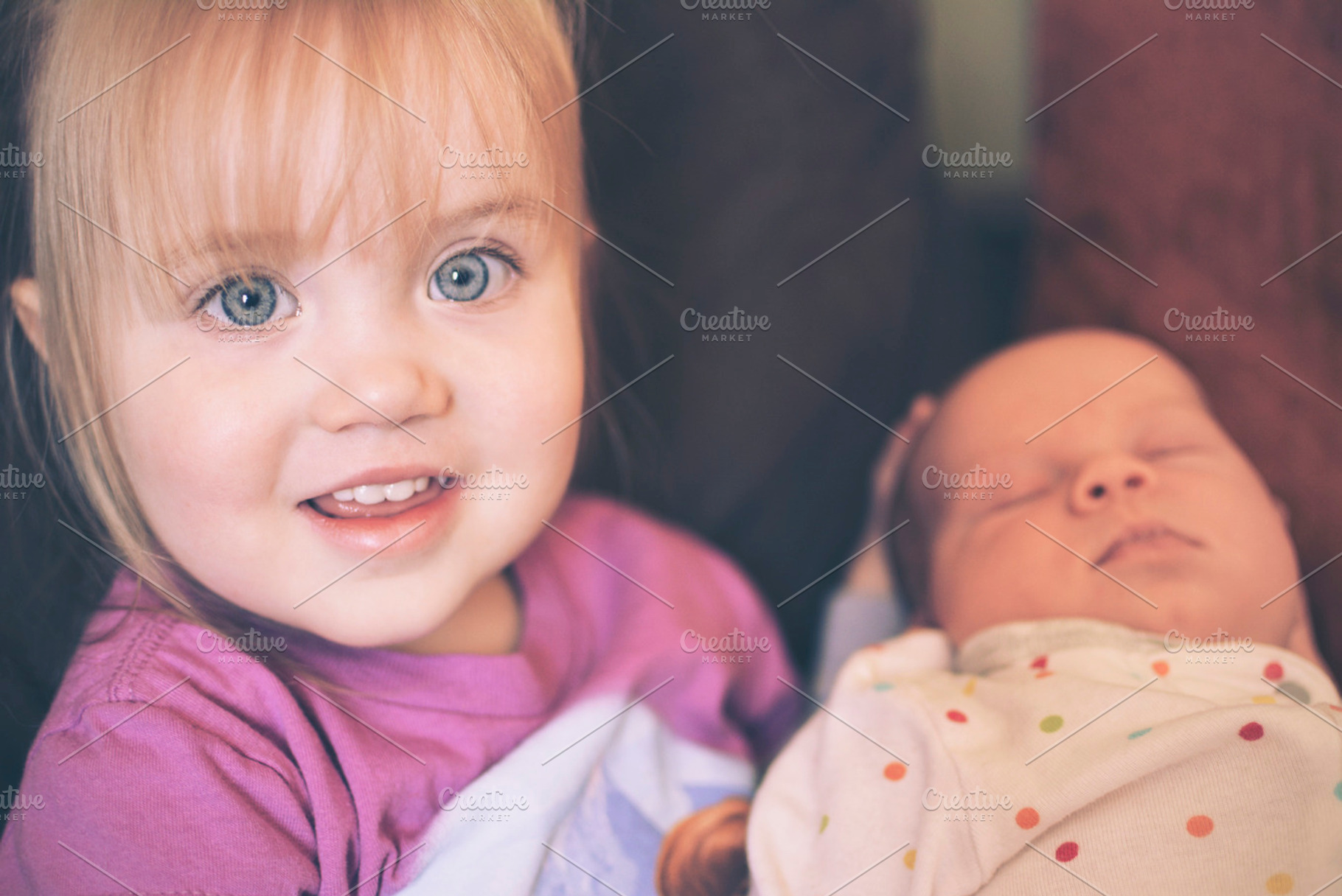 Child holding baby