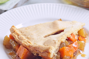 Delicious homemade apple and sweet potato cobbler pie showing filling ingredien, a Food & Drink Photo by iuliia_n