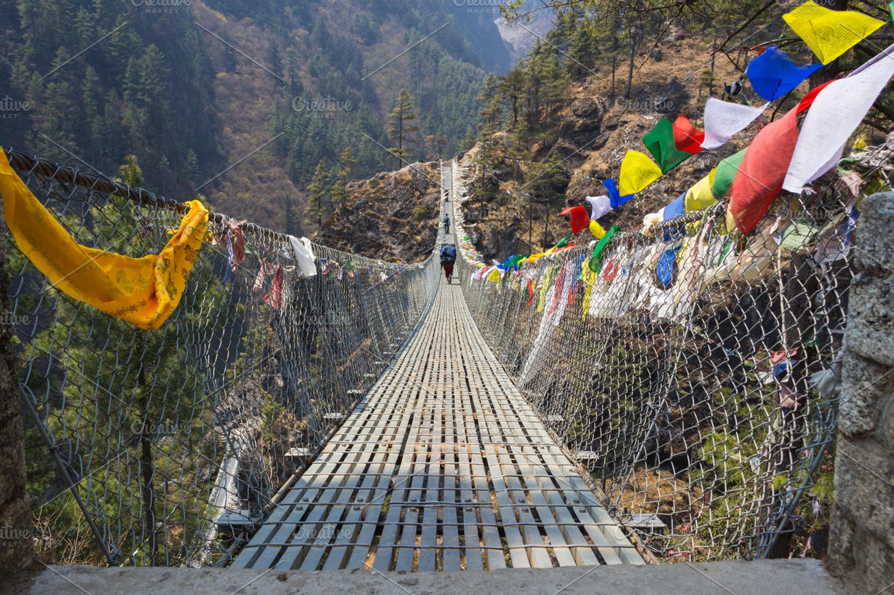 Suspension bridge in mountains, a Nature Photo by WhiteMountMedia