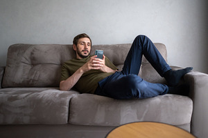 Man casually lying on a comfortable