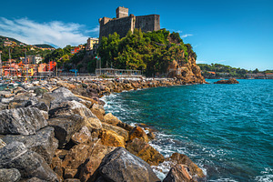 Lerici view with the sea and castle, an Architecture Photo by Alpine Dreams