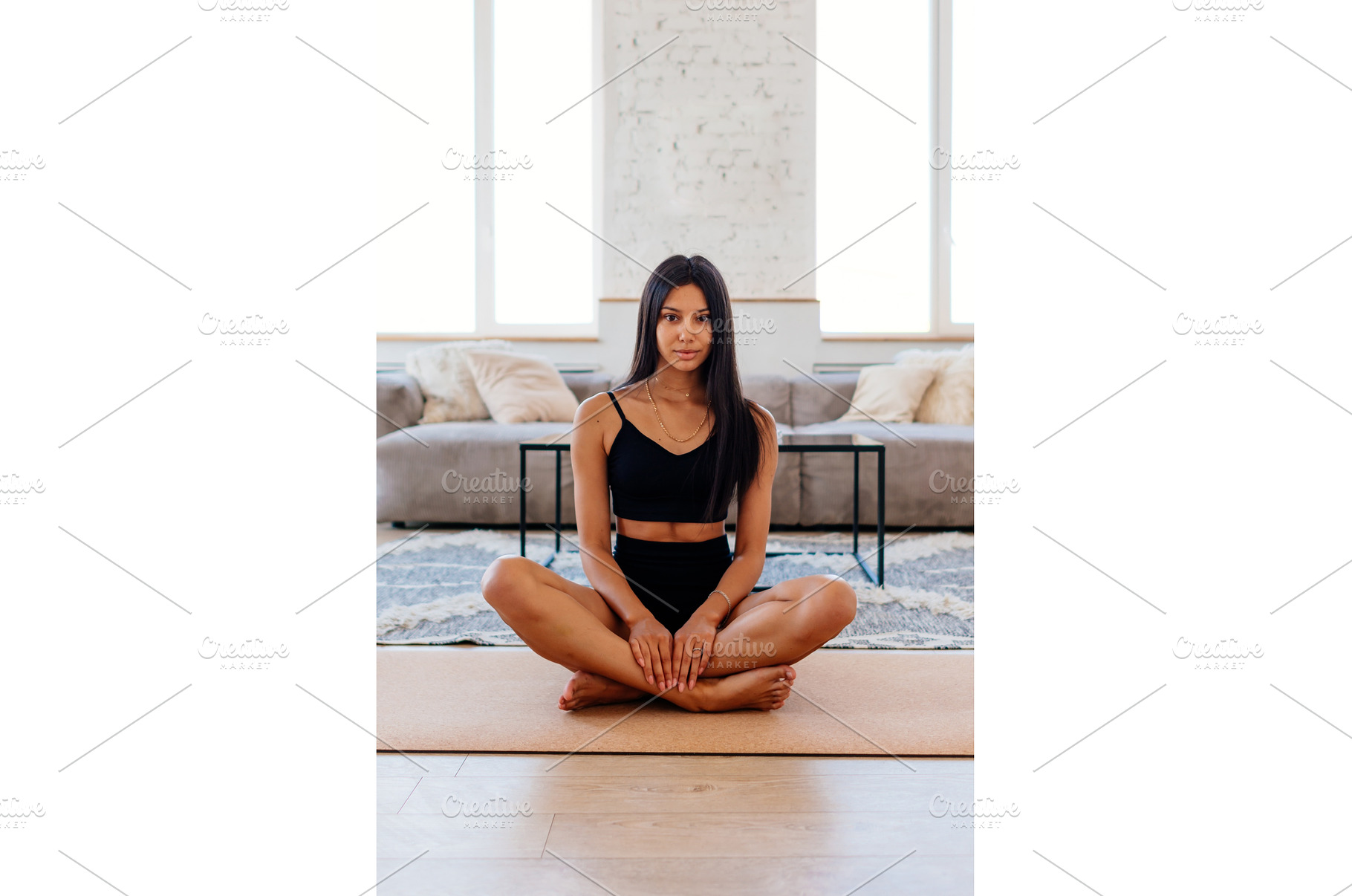 Woman sits cross-legged on the floor, a Sports & Recreation Photo by undrey