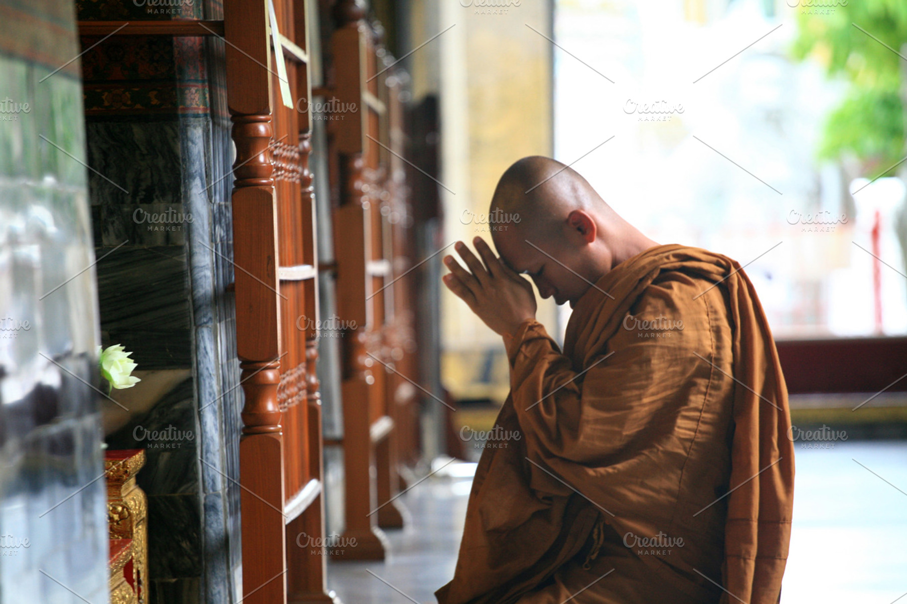 Thai buddhist monk praying stock photo containing monk and thailand, a Person Photo by VIBE Collective