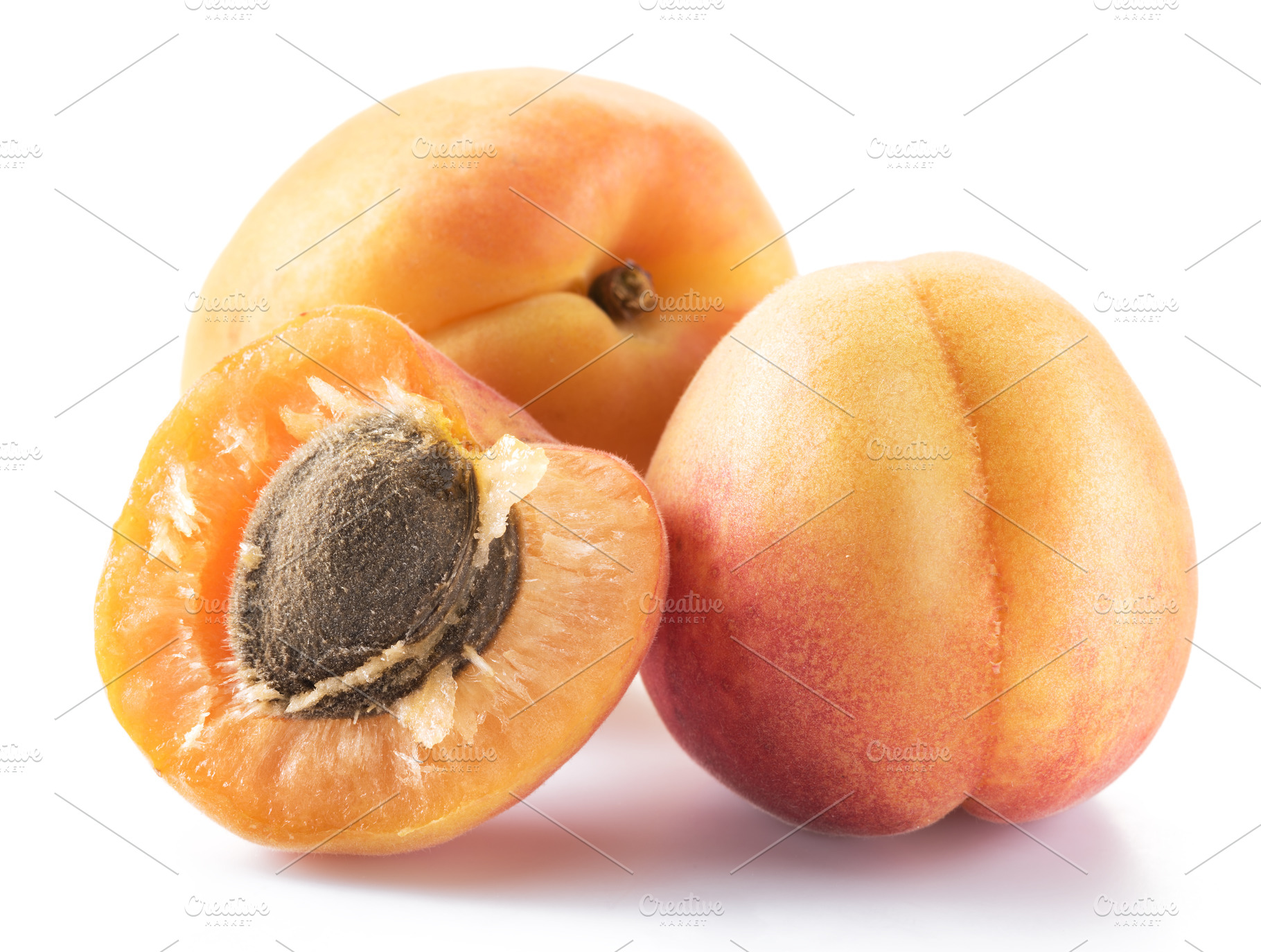 Ripe apricots isolated on the white, a Photo by Volff