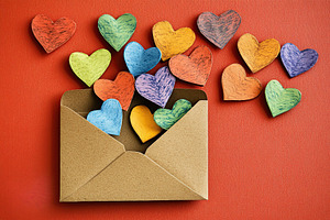Valentines letter envelope with paper hearts, a Holiday Photo by AlyaAnd