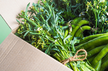 Green produce in cardboard box containing healthy, produce, and green, a Food & Drink Photo by Lifemorning