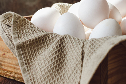 Fresh Organic eggs on Wooden Surface