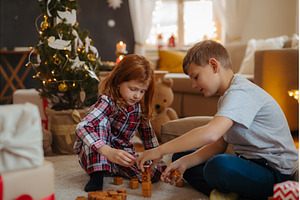 Kids playing with wooden blocks at, a Holiday Photo by HalfPoint