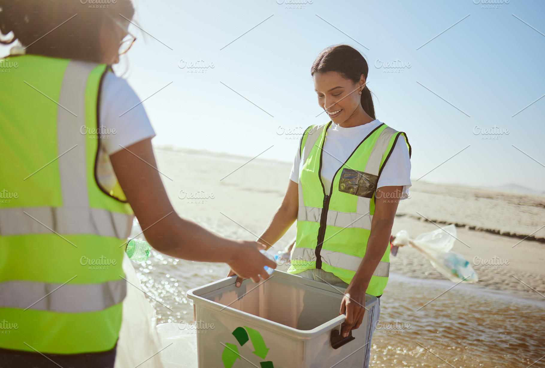 Garbage recycle, beach and eco friendly team and action for ocean waste. Pollution recycling, youth and cleaning ocean sea for environmental sustainability, volunteer teamwork and global ecology., a Photo by Peopleimages.com