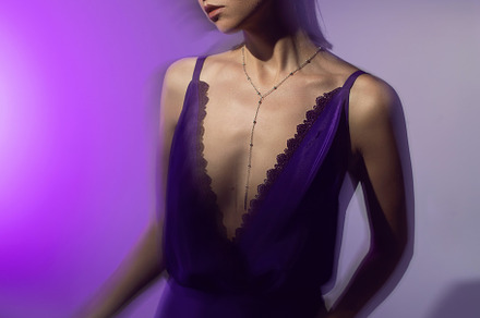 portrait of a brunette woman in a purple dress on white background in the studi, a Person Photo by SaulichPhoto