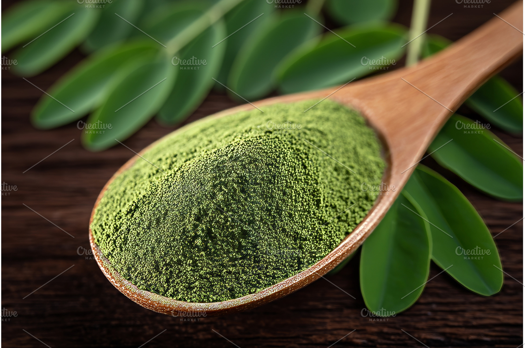 A wooden spoon holds green barley, a Food & Drink Photo by ZinetroN