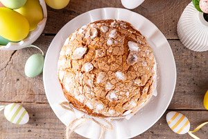 Traditional Easter cake paska or panettone with festive Easter d, a Holiday Photo by Rimma