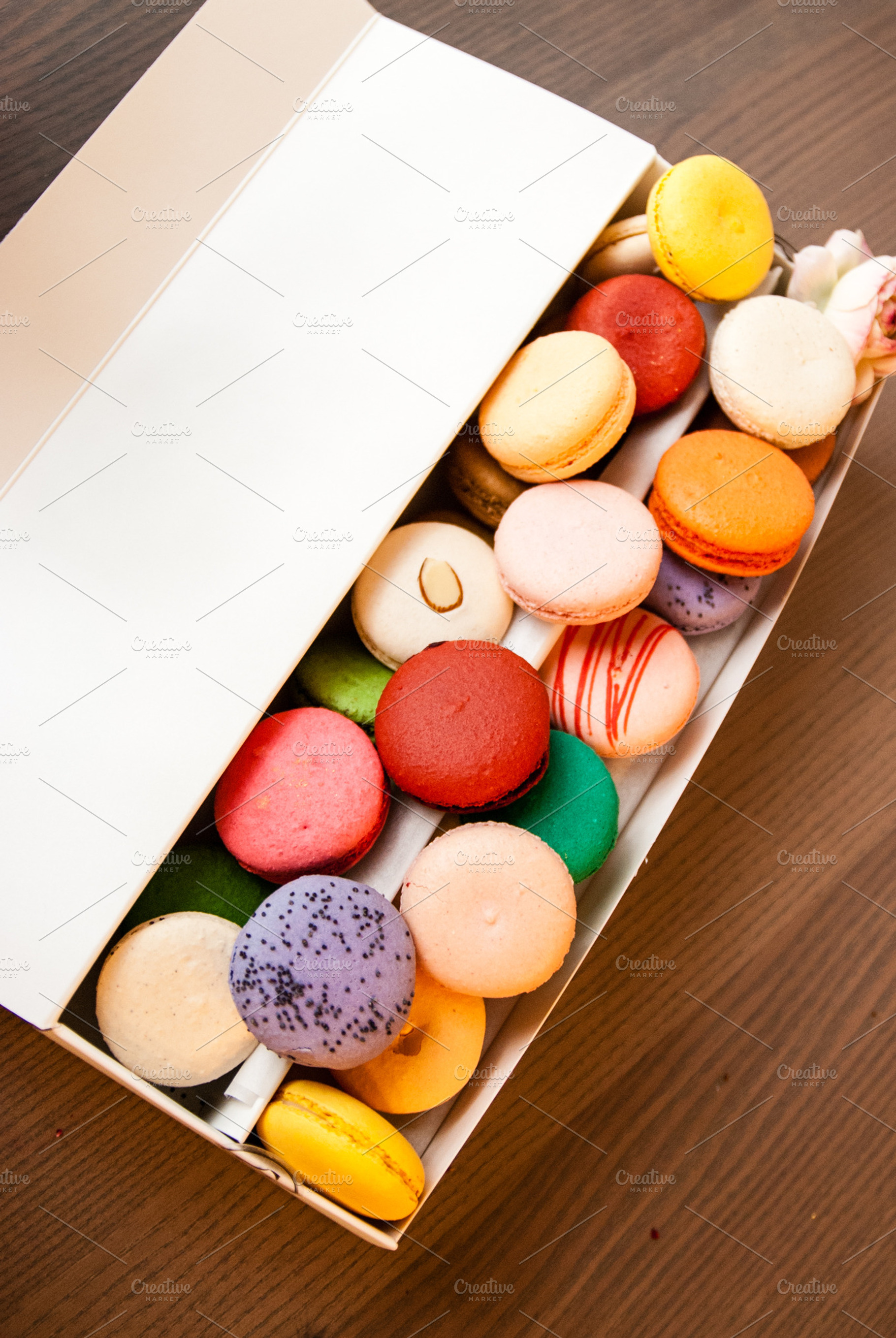 Box of macarons containing macaron, dessert, and pastry, a Food & Drink Photo by preetim