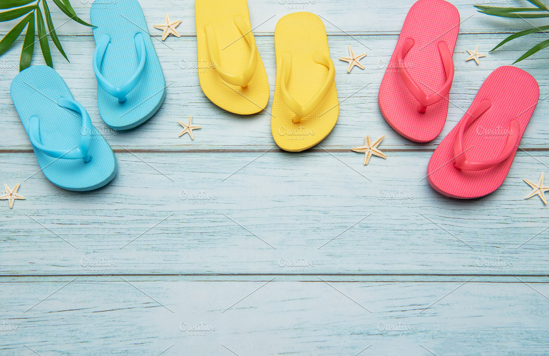 Colorful flip flops and starfish creating summer vacation atmosp, a Holiday Photo by Olena Rudo