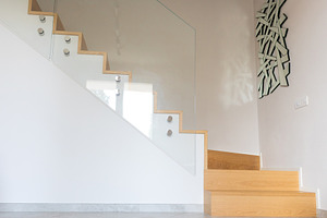 Modern wooden staircase with glass balustrade enhancing home interior, an Architecture Photo by Antonio Gravante Market