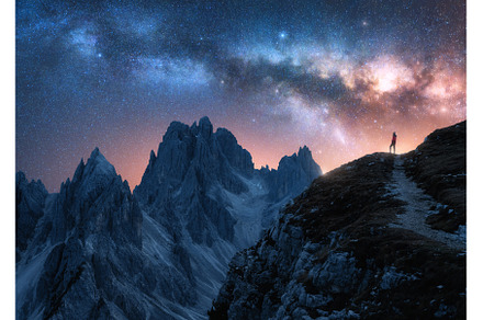 Glowing Milky Way and woman on