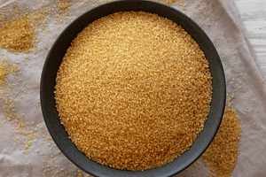 Organic Demerara Sugar in a Bowl, top view. Close-up., a Food & Drink Photo by LiudmylaChuhunova