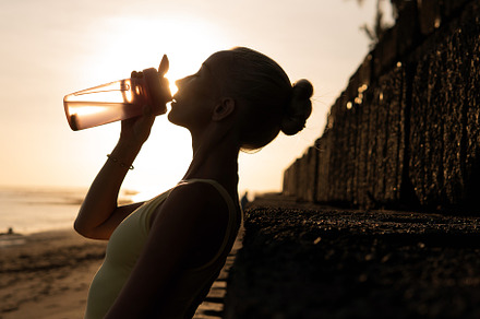 Beautiful woman drinking water