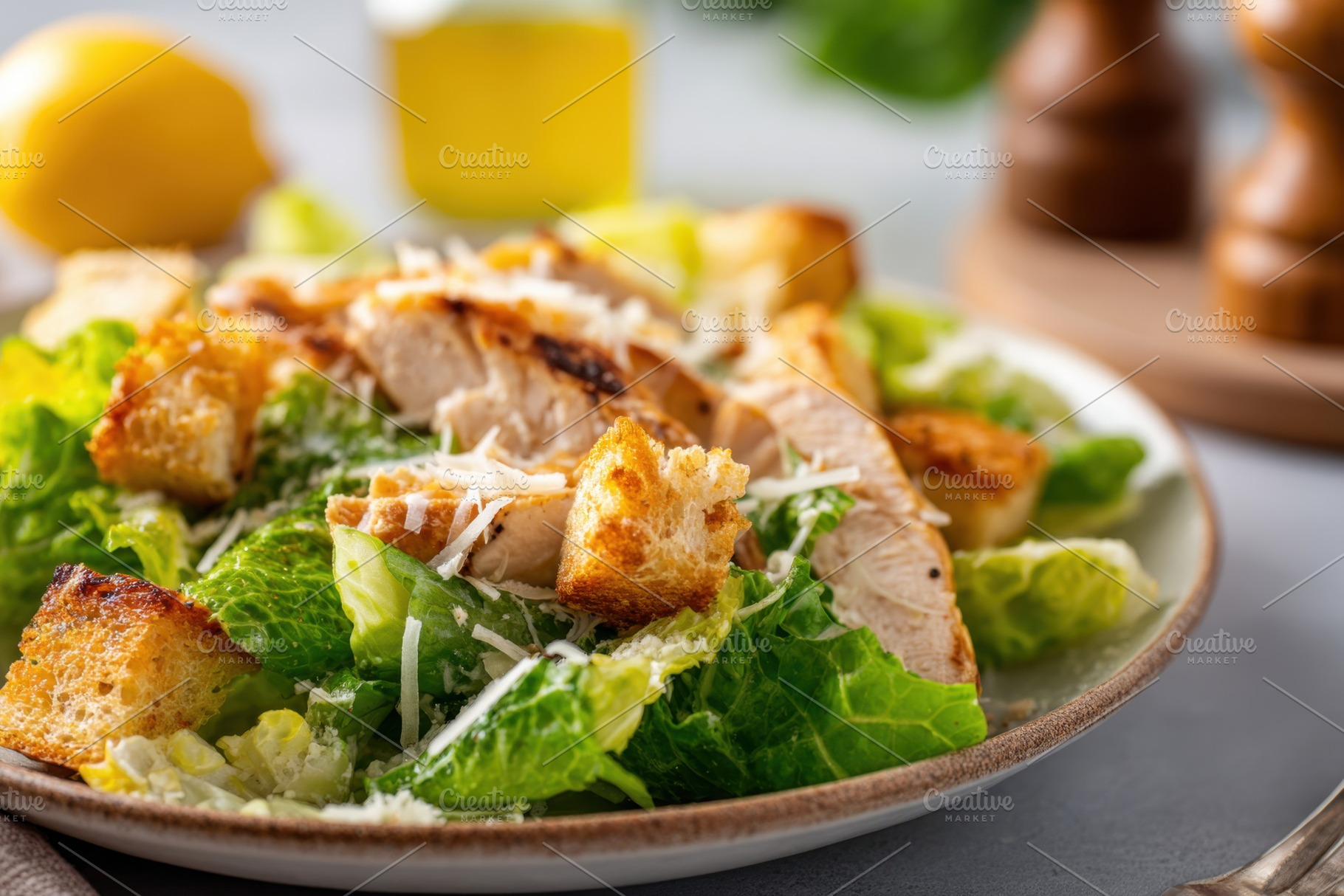 Fresh caesar salad with grilled chicken and croutons, a Food & Drink Photo by AlyaAnd