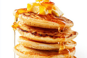 Stack of pancakes with syrup and butter, a Food & Drink Photo by AlyaAnd