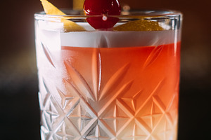 Cocktail drink tropical beverage glass zest cherry, a Food & Drink Photo by Photo Drive Studio