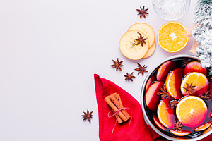 Cooking mulled wine with oranges, ap
