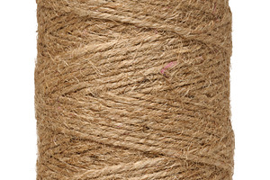 Roll of natural jute rope for packaging on isolated background, an Industrial Photo by ndanko