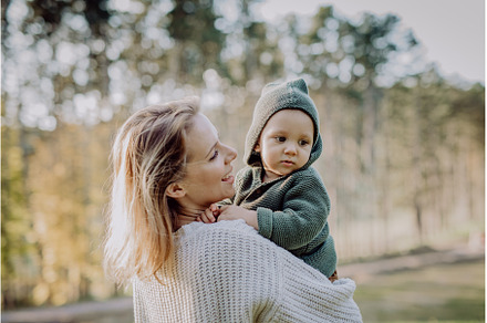 Mother holding her little baby son, a Nature Photo by HalfPoint