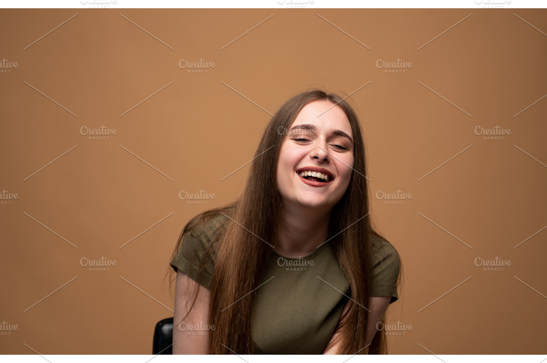 Young woman bursting with laughter, a Person Photo by volodymyrshtun13795