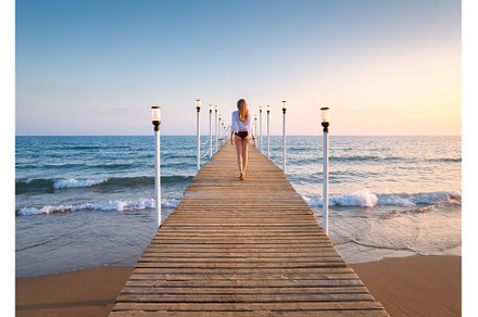Happy young woman in bikini walking, a Person Photo by den-belitsky